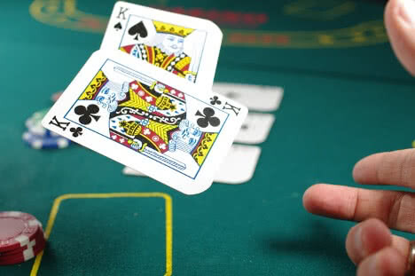 cards-flying-above-table